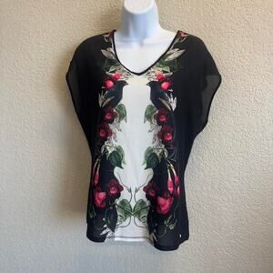 Ted baker black and white floral blouse with short sleeves and raven pattern